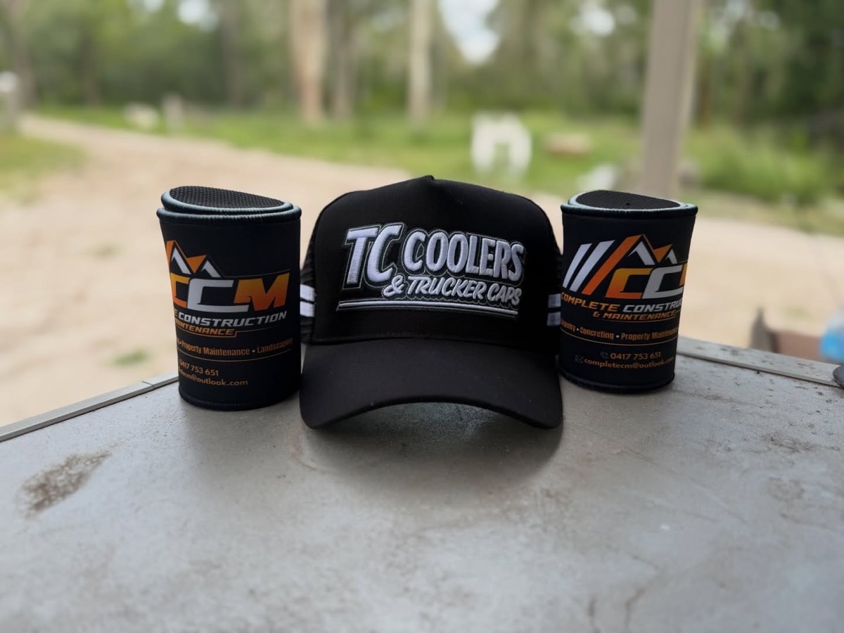 Custom black stubby coolers and TC Coolers trucker cap for Complete Construction & Maintenance