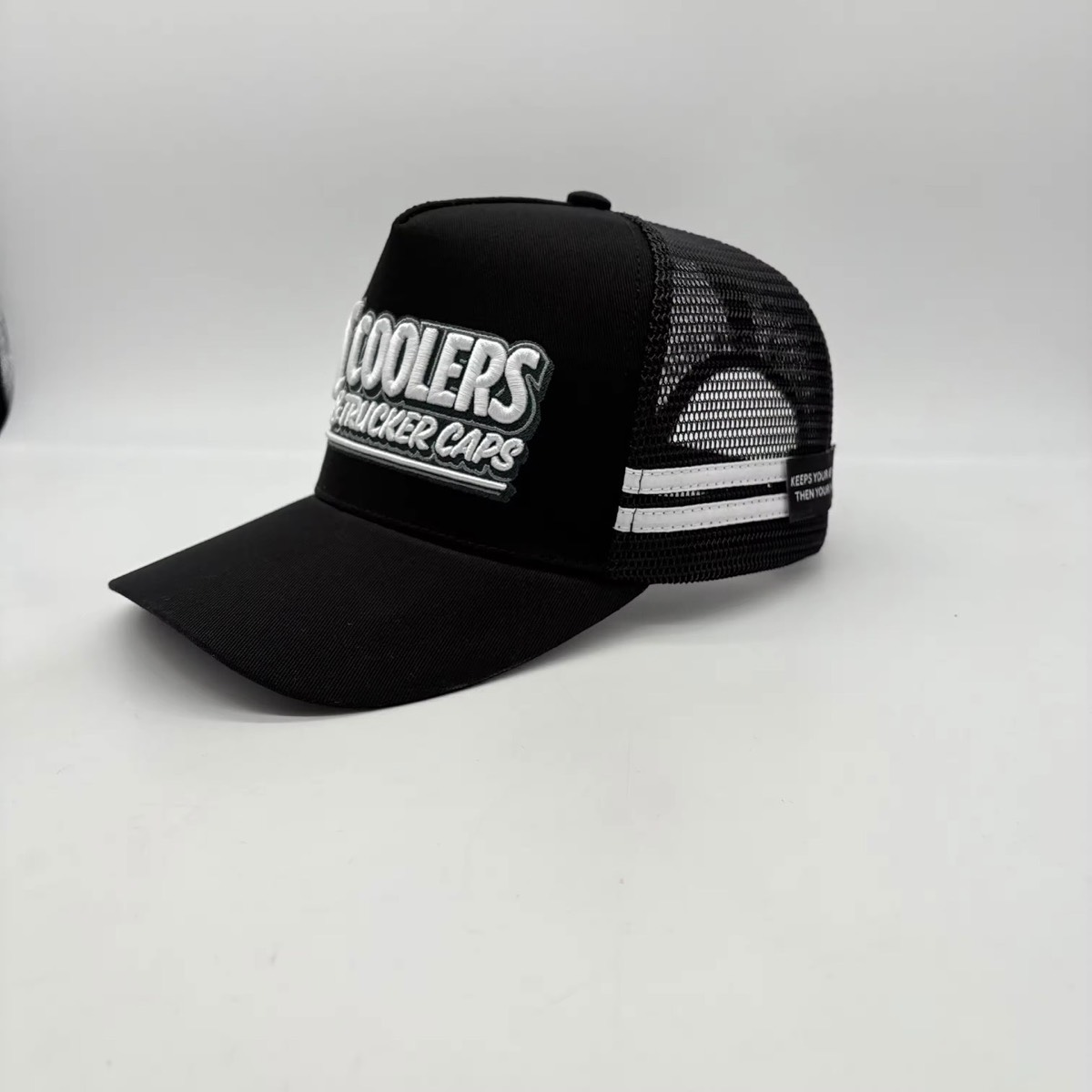 Black embroidered TC Coolers trucker cap